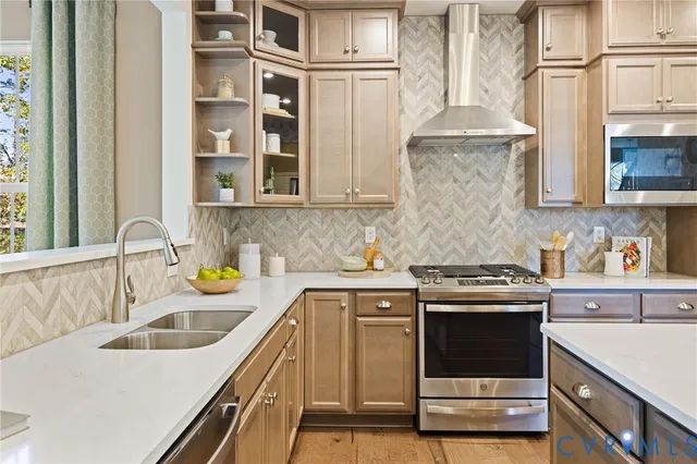 a stove top oven sitting inside of a kitchen