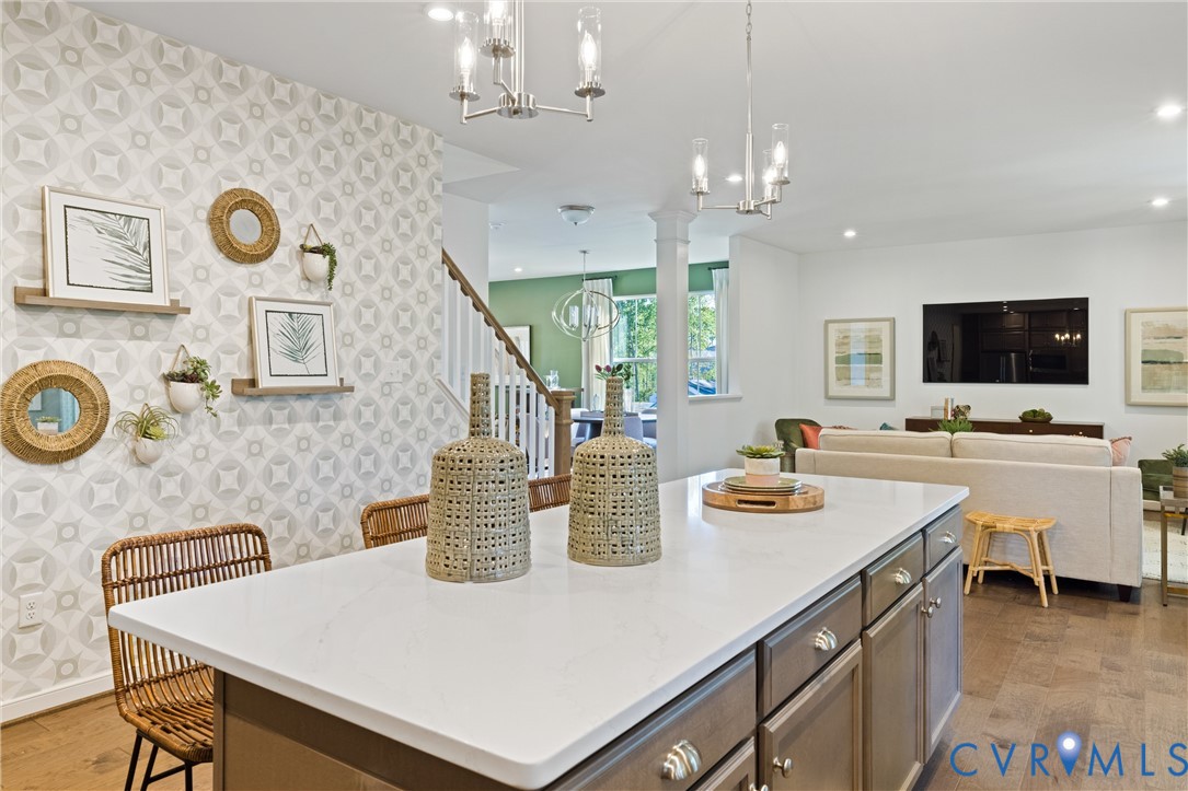 979 Charlemagne Road Midlothian, VA 23114 - Photo 16 of 50 a kitchen with a sink a stove and chairs