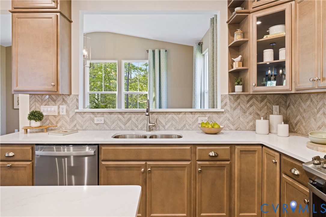 979 Charlemagne Road Midlothian, VA 23114 - Photo 19 of 50 a kitchen with a sink a window and cabinets
