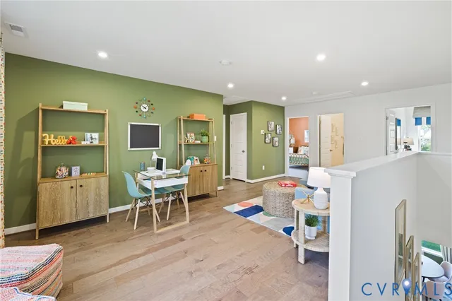 a spacious bedroom with a bed and a chandelier