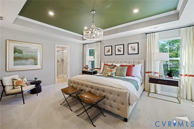 a bed room with a bed mirror and a chandelier