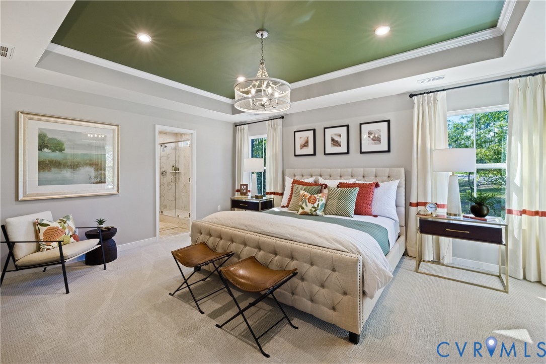 979 Charlemagne Road Midlothian, VA 23114 - Photo 24 of 50 a spacious bedroom with a bed and a chandelier