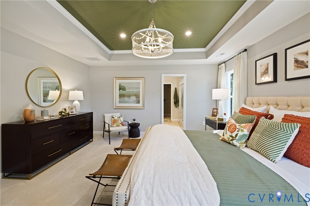 979 Charlemagne Road Midlothian, VA 23114 - Photo 25 of 50 a bed room with a bed mirror and a chandelier