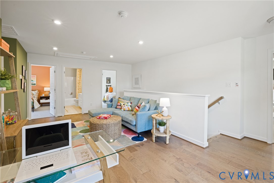 979 Charlemagne Road Midlothian, VA 23114 - Photo 29 of 50 a living room with furniture and a fireplace