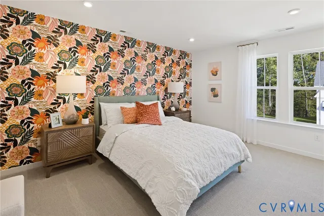 a bedroom with a bed and a couch