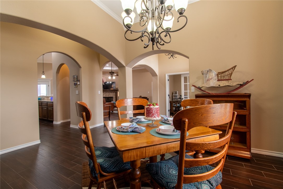 5309 Capernaum Court Corpus Christi, TX 78413 - Photo 15 of 40 a view of a dining room with furniture and wooden floor