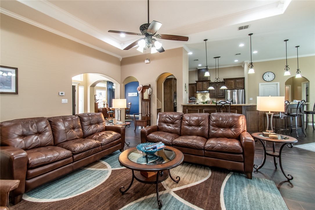 5309 Capernaum Court Corpus Christi, TX 78413 - Photo 18 of 40 a living room with furniture and a chandelier