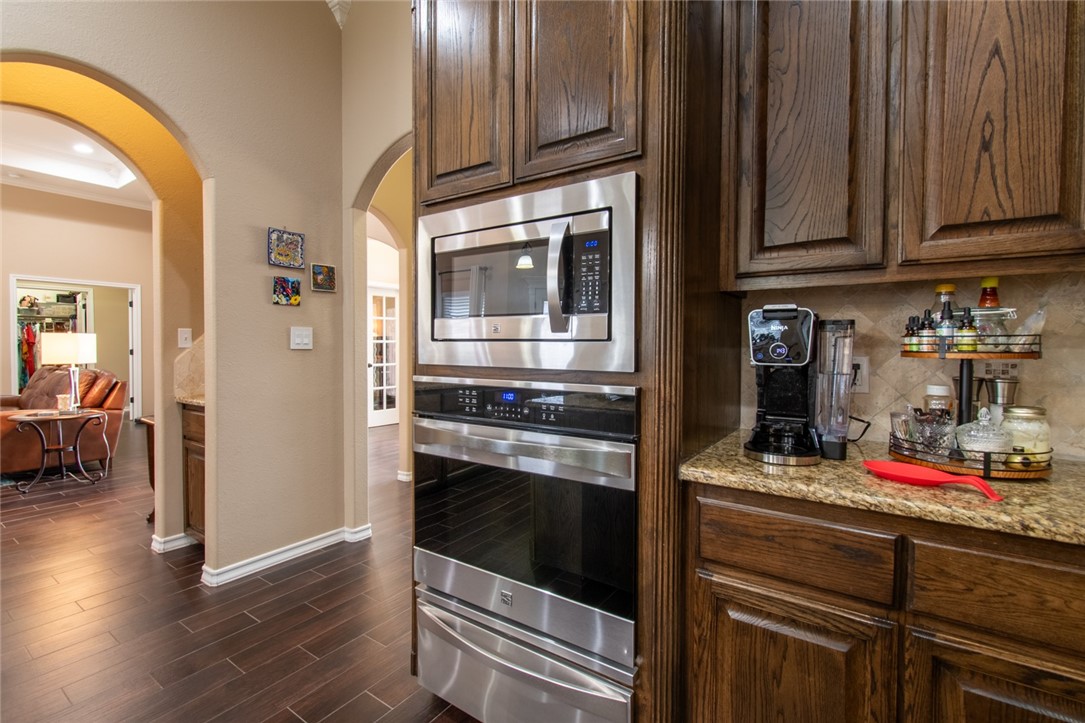 5309 Capernaum Court Corpus Christi, TX 78413 - Photo 27 of 40 a kitchen with stove and cabinets