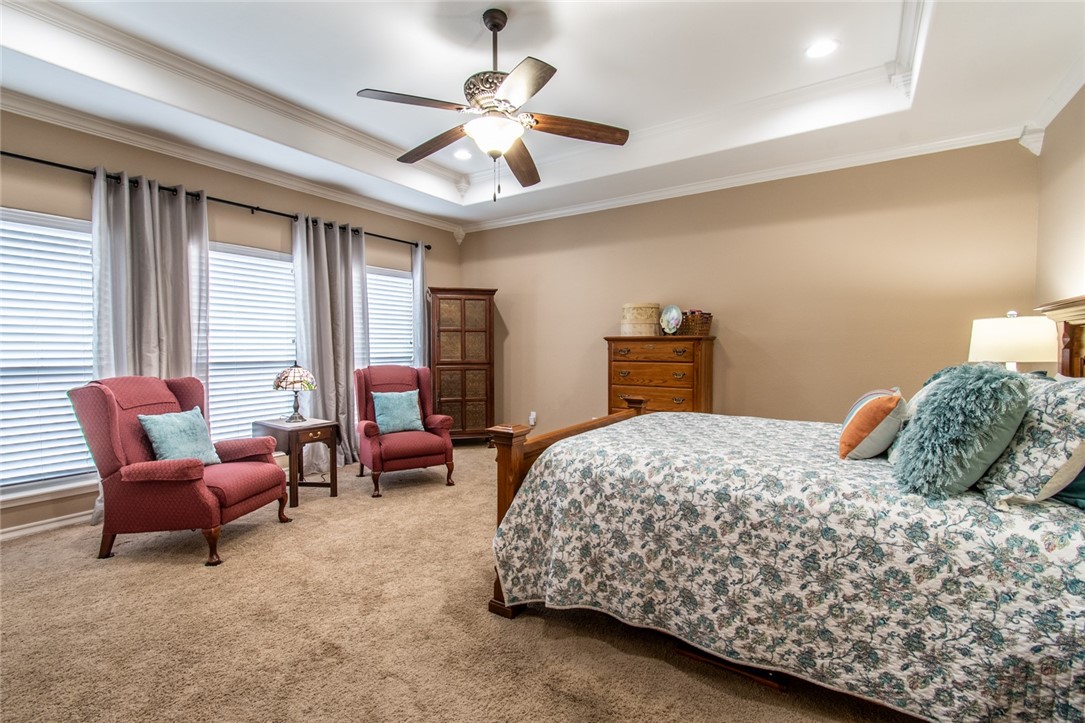 5309 Capernaum Court Corpus Christi, TX 78413 - Photo 3 of 40 a bedroom with a bed a couch and dresser