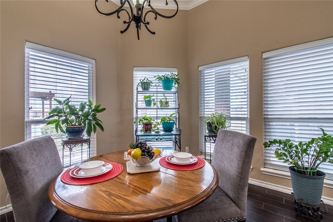 5309 Capernaum Court Corpus Christi, TX 78413 - Photo 31 of 40 a view of a dining room with furniture window and wooden floor