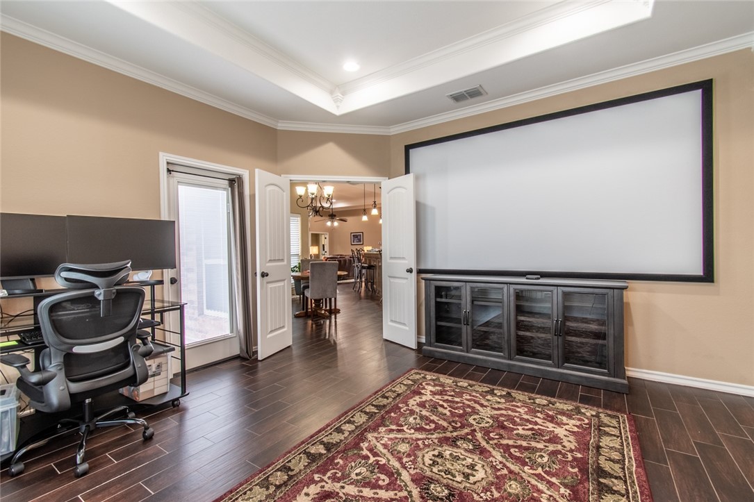 5309 Capernaum Court Corpus Christi, TX 78413 - Photo 33 of 40 a view of a workspace with furniture and wooden floor