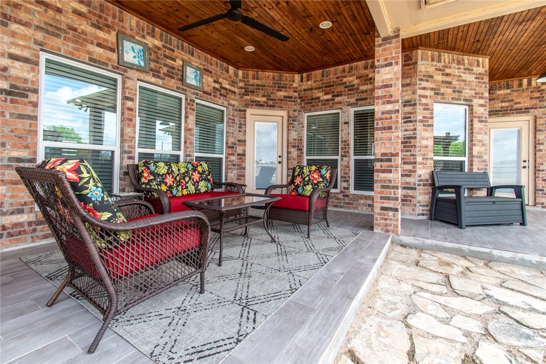 5309 Capernaum Court Corpus Christi, TX 78413 - Photo 36 of 40 a building outdoor space with patio furniture and wooden floor