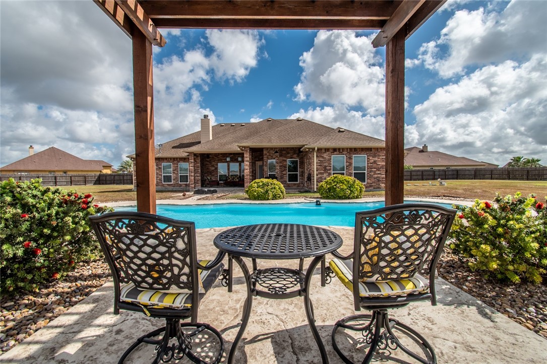 5309 Capernaum Court Corpus Christi, TX 78413 - Photo 39 of 40 a patio with table and chairs