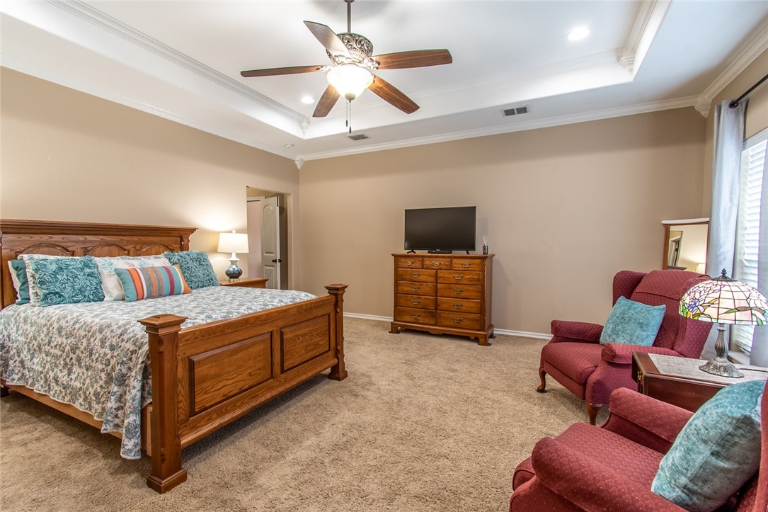 5309 Capernaum Court Corpus Christi, TX 78413 - Photo 5 of 40 a bedroom with furniture and a flat screen tv