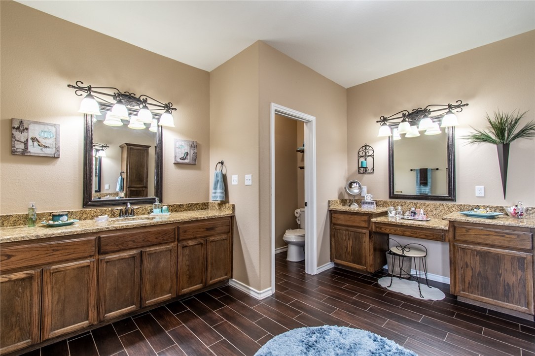 5309 Capernaum Court Corpus Christi, TX 78413 - Photo 8 of 40 a spacious bathroom with a double vanity sink and a mirror