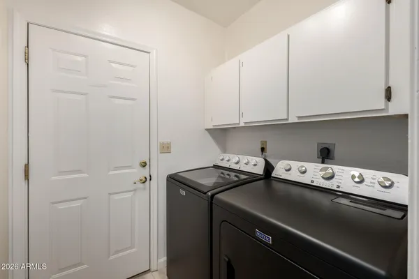 a kitchen with a stove and a cabinets