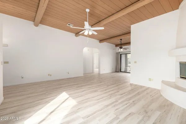 a view of a room with a ceiling fan