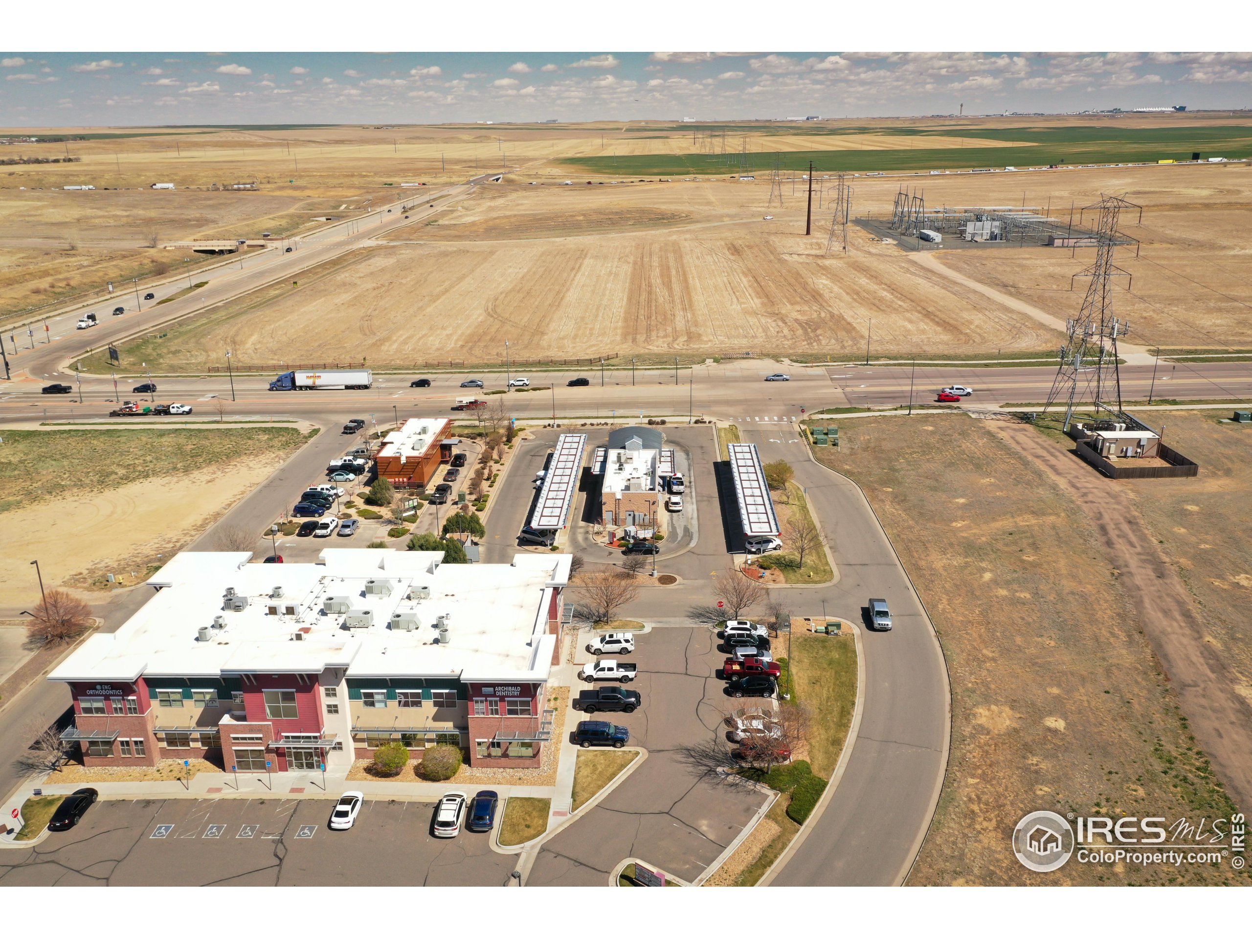 10319 Tower Road Commerce City, CO 80022 - Photo 4 of 13 a view of a swimming pool with an ocean view