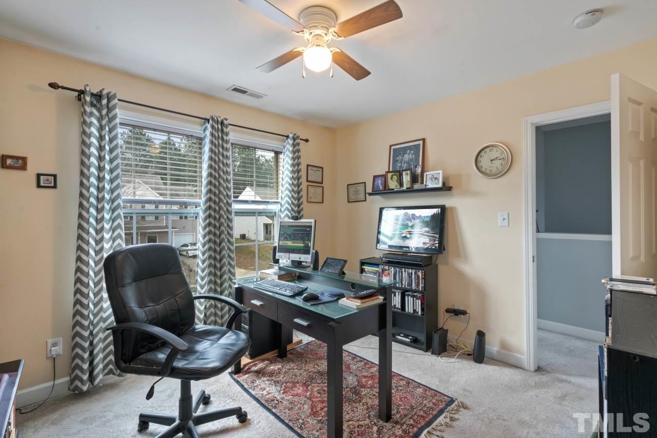 2307 King Malcolm Lane Zebulon, NC 27597 - Photo 11 of 30 a work room with furniture and a window