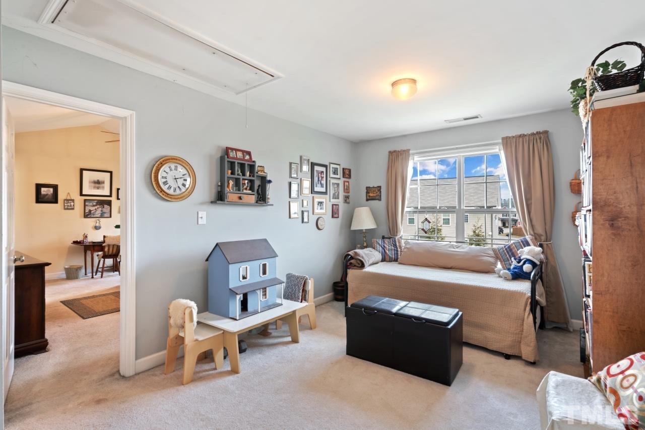 2307 King Malcolm Lane Zebulon, NC 27597 - Photo 17 of 30 a living room with furniture and a window