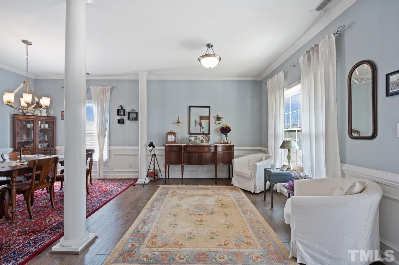 2307 King Malcolm Lane Zebulon, NC 27597 - Photo 6 of 30 a living room with furniture and wooden floor