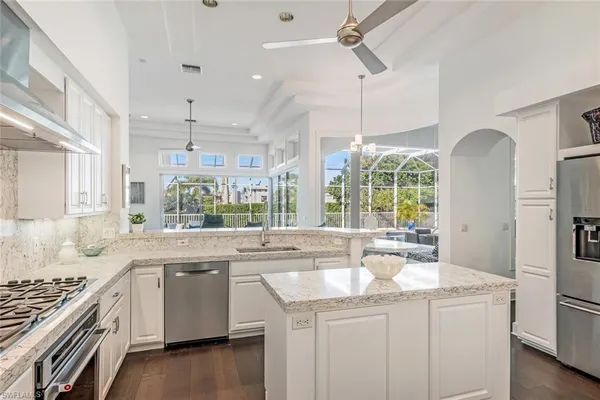 a kitchen with a sink stove and cabinets