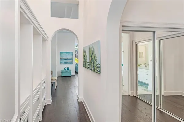 a view of an entryway with wooden floor