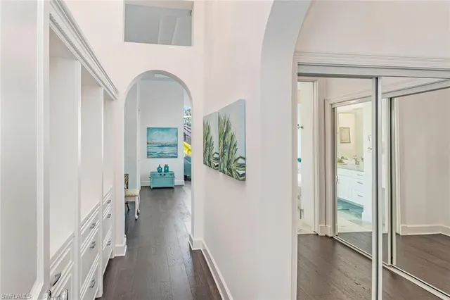a view of an entryway with wooden floor