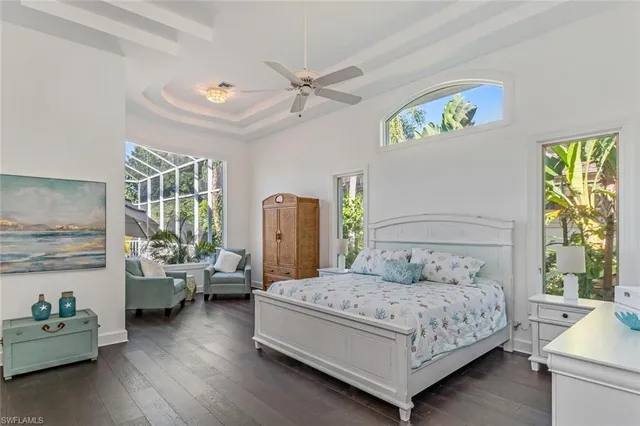 a bedroom with a bed couch and a window