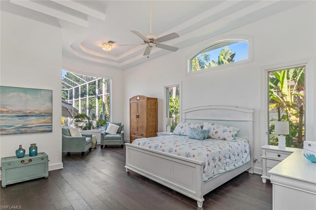 2540 Half Moon Walk Naples, FL 34102 - Photo 24 of 44 a bedroom with a bed couch and a window