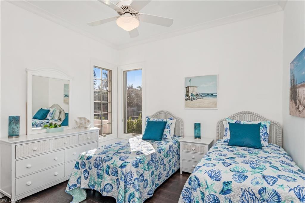 2540 Half Moon Walk Naples, FL 34102 - Photo 33 of 44 a bedroom with two beds and a dresser