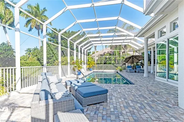 a view of a swimming pool with a porch