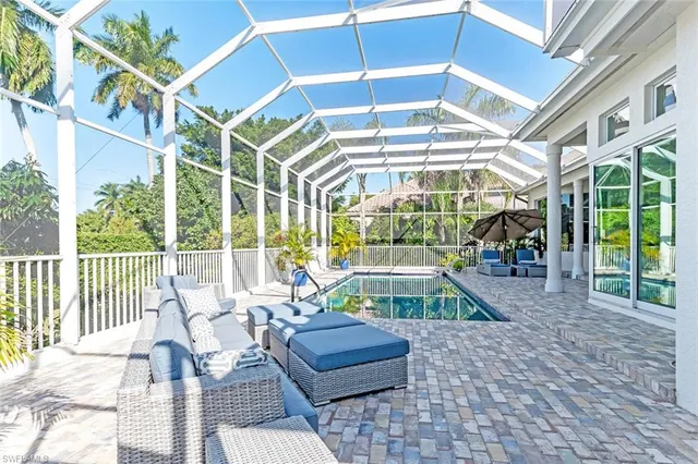 a view of a swimming pool with a porch