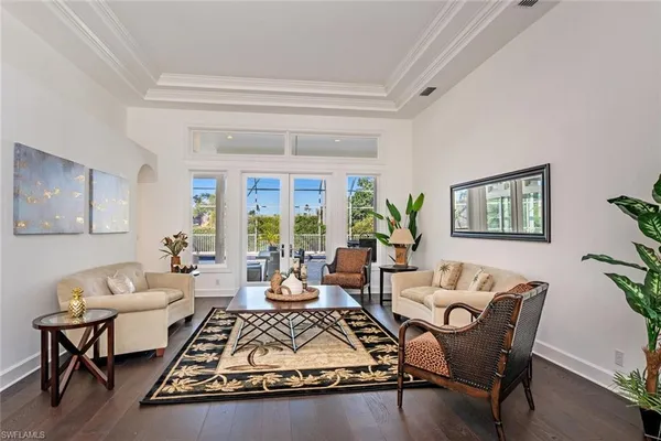 a living room with furniture rug and window