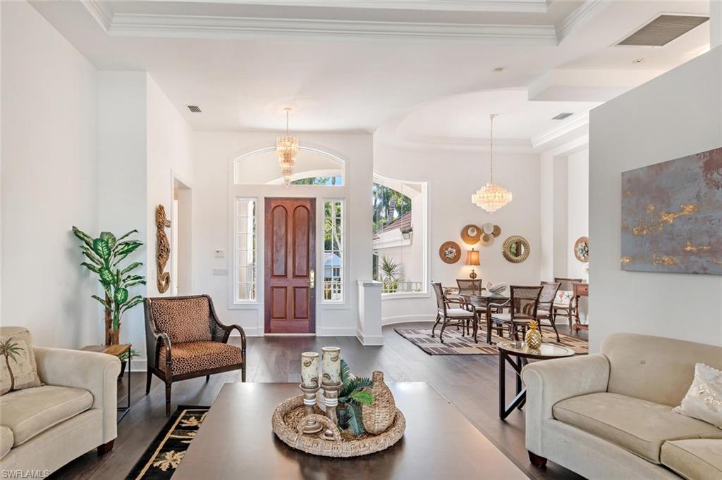2540 Half Moon Walk Naples, FL 34102 - Photo 5 of 44 a living room with furniture and wooden floor