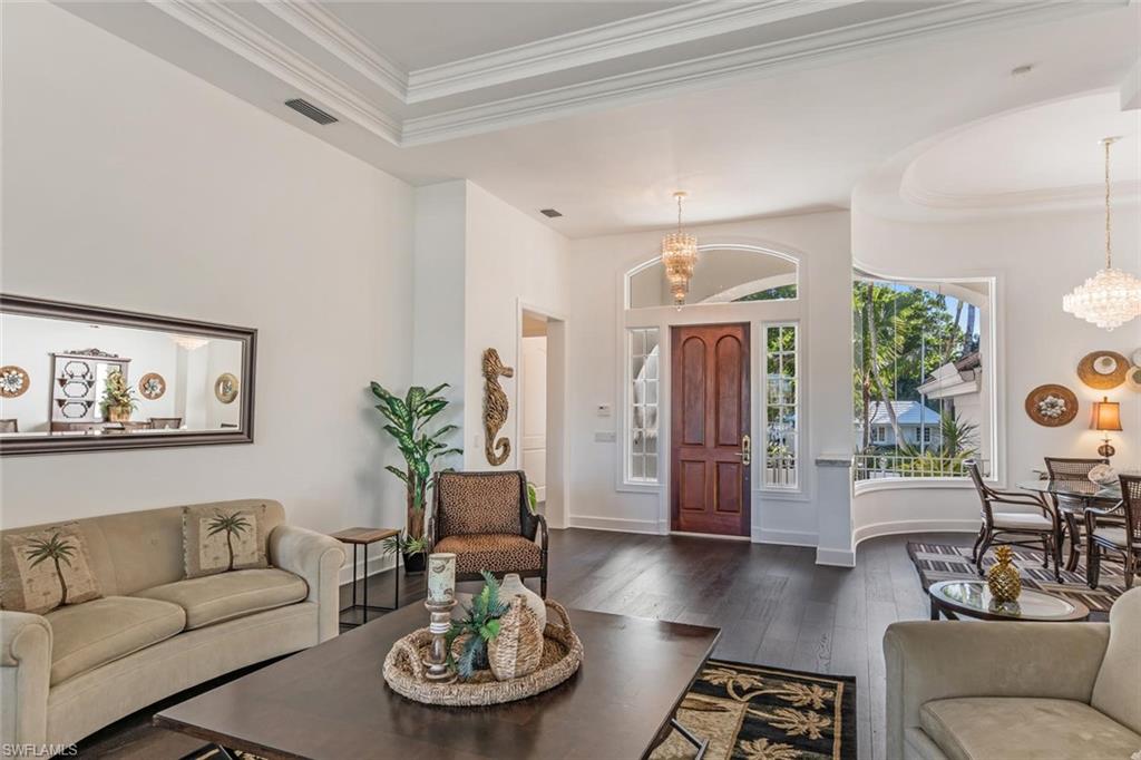 2540 Half Moon Walk Naples, FL 34102 - Photo 6 of 44 a living room with furniture and wooden floor