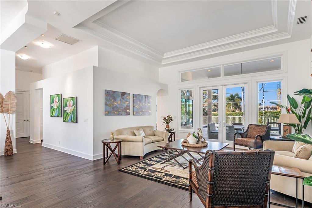 2540 Half Moon Walk Naples, FL 34102 - Photo 8 of 44 a living room with furniture and wooden floor