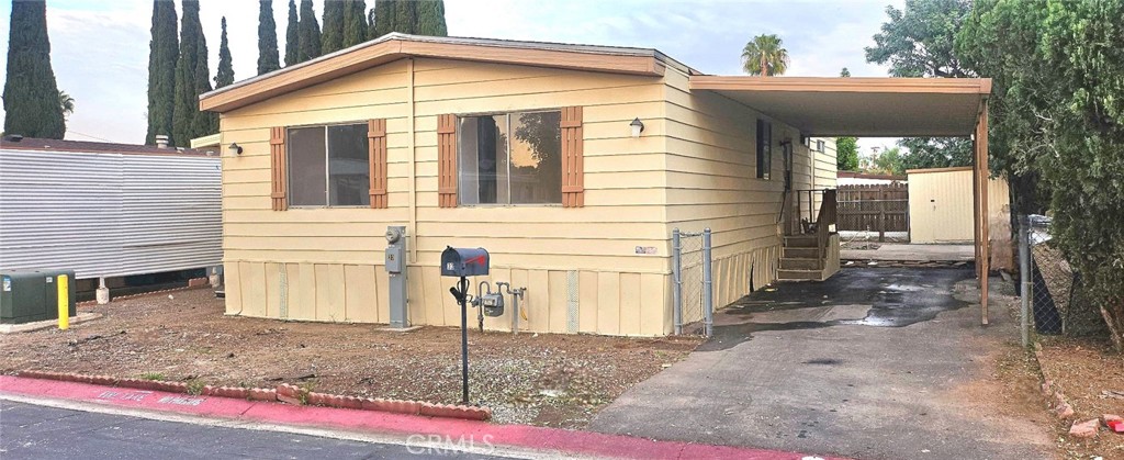 995 Pomona Road, Unit 33 Corona, CA 92882 - Photo 2 of 8 a view of a house with a yard