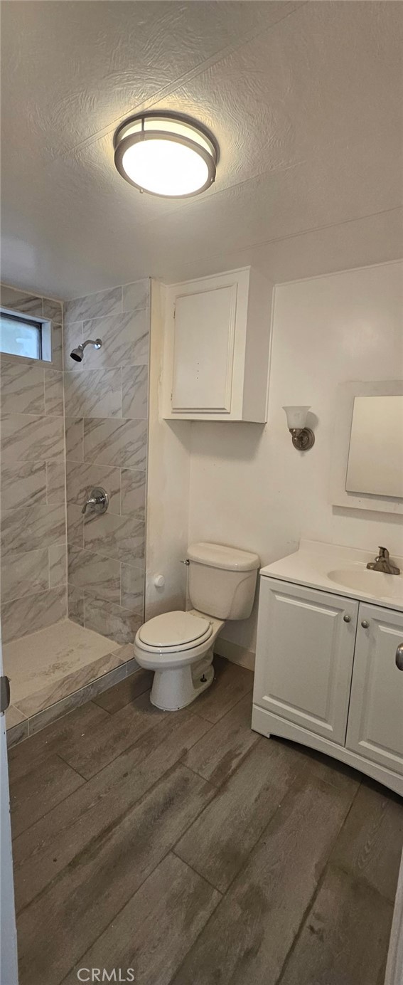 995 Pomona Road, Unit 33 Corona, CA 92882 - Photo 7 of 8 a bathroom with a sink a toilet and shower