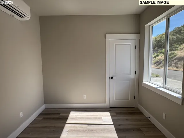 a view of an empty room and window
