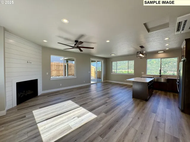 a view of kitchen with cabinets and wooden floor