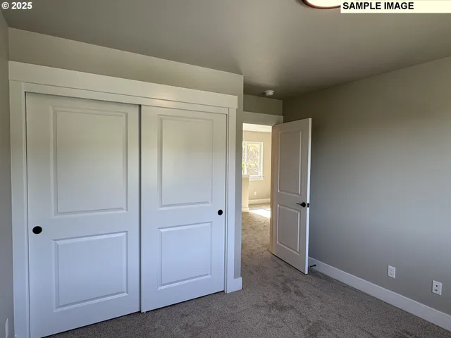 an empty room with closet area