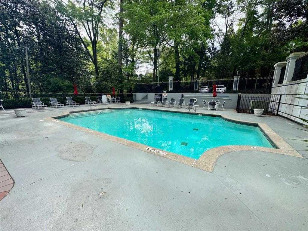 3201 Lenox Road Northeast, Unit 2 Atlanta, GA 30324 - Photo 26 of 39 a view of a swimming pool with a patio