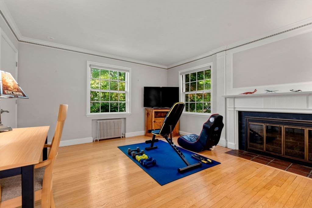 30 Nickerson Road Newton, MA 02467 - Photo 23 of 38 a living room with furniture window and a fireplace