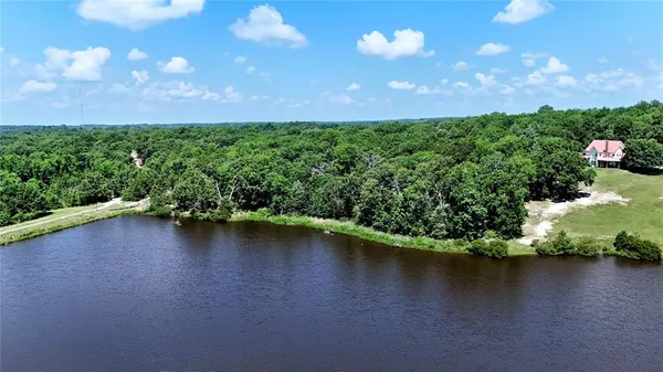 a view of a lake with a yard