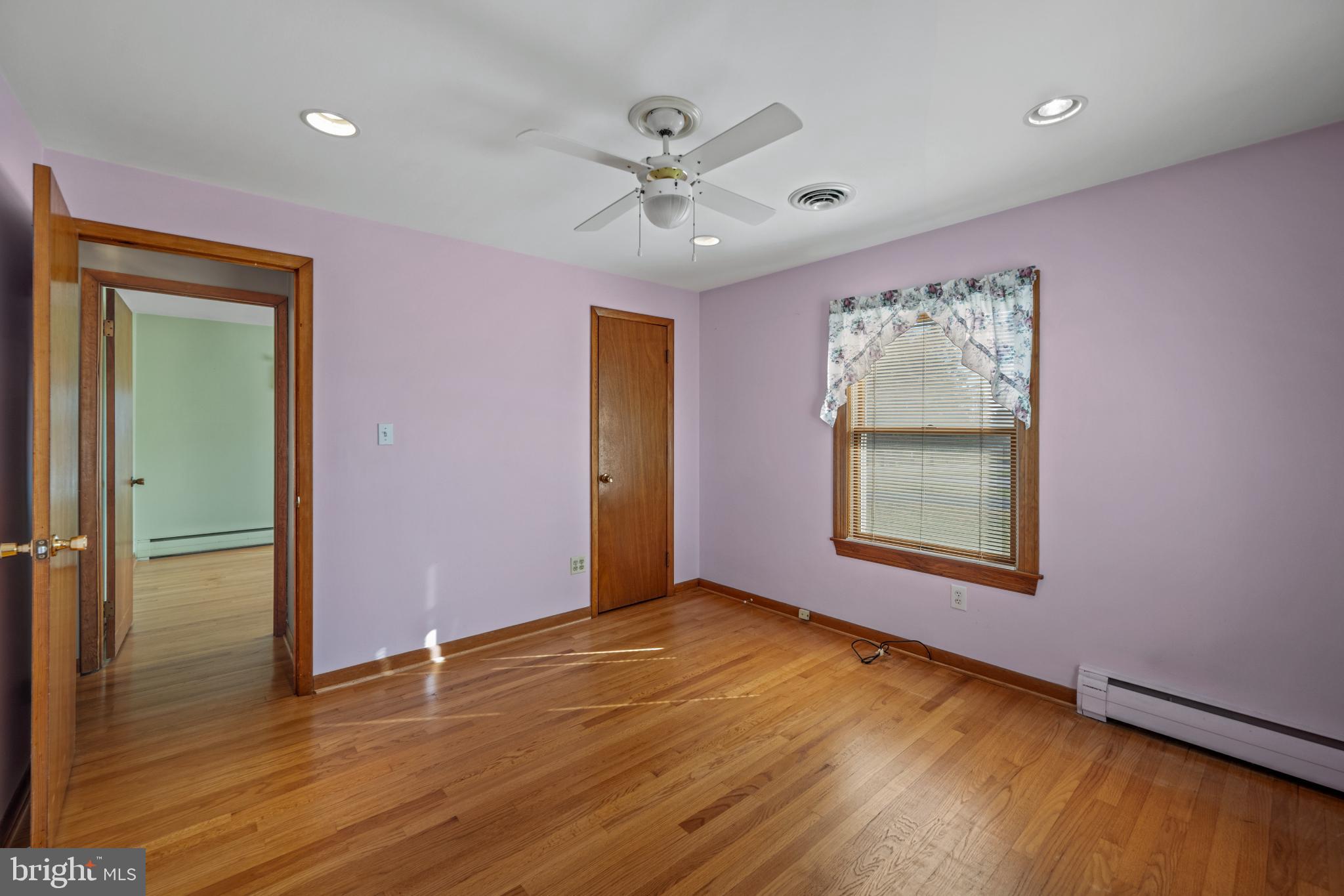 4929 Millers Station Road Hampstead, MD 21074 - Photo 14 of 56 Charming primary bedroom with natural light.