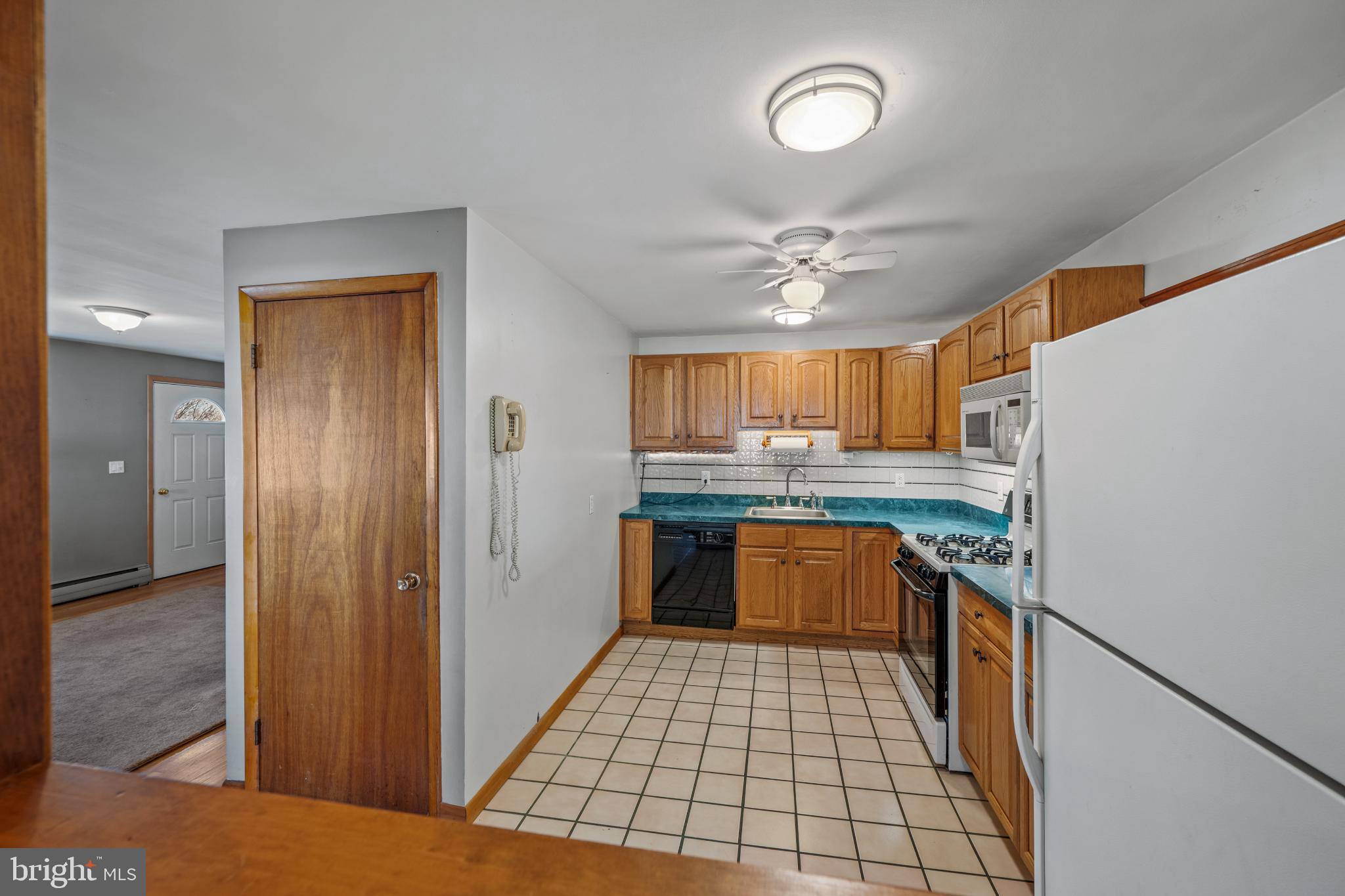 4929 Millers Station Road Hampstead, MD 21074 - Photo 19 of 56 Cozy kitchen with warm wooden accents.