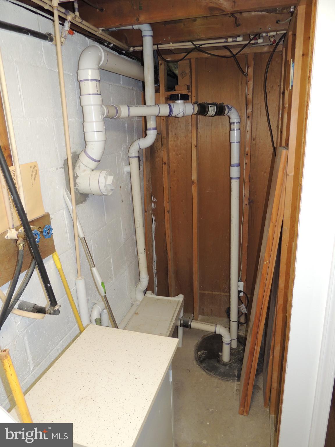 4929 Millers Station Road Hampstead, MD 21074 - Photo 38 of 56 Utility space with sump pump.