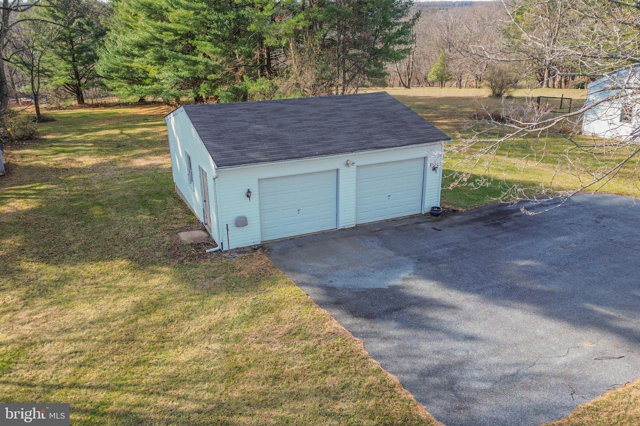 4929 Millers Station Road Hampstead, MD 21074 - Photo 44 of 56 Charming garage nestled in serene landscape.