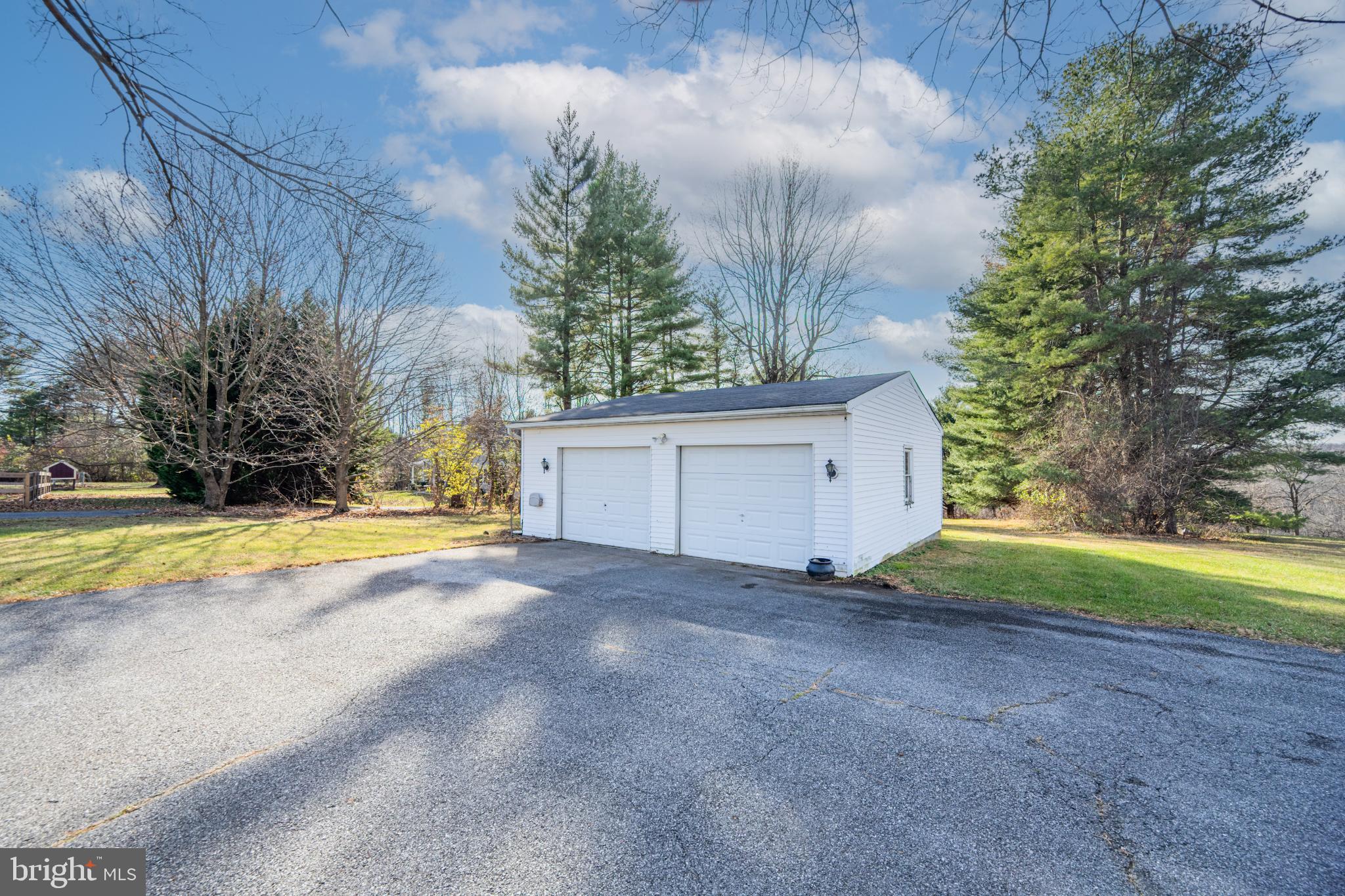 4929 Millers Station Road Hampstead, MD 21074 - Photo 8 of 56 Charming garage nestled in serene greenery.